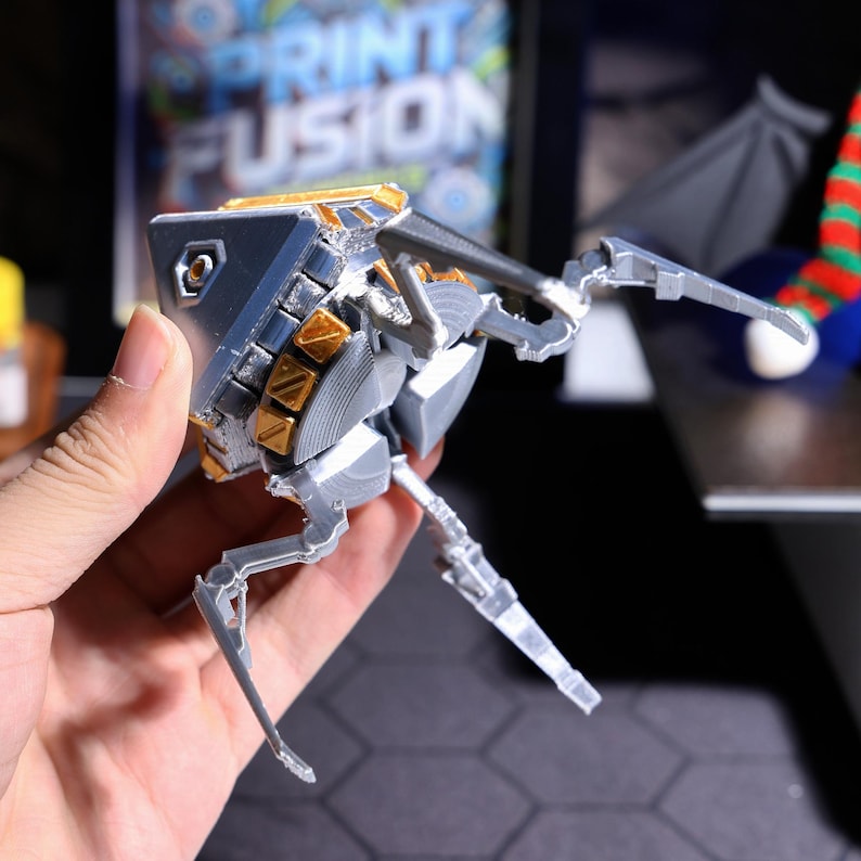 Apex Legends themed loot box phone stand, handmade from eco-friendly PLA, multi-purpose gaming accessory for hands-free viewing and gaming, a thoughtful gift idea for gamers looking to decorate their gaming desk.