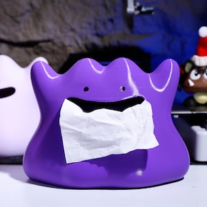 Creative monster-shaped tissue box with soft texture, 3D printed design, and stable magnetic base. Ideal for use as gaming decor or quirky home accessories. A perfect gift for fans of playful and unique decor items.
