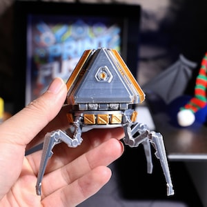 High-quality handcrafted phone stand with 3D printed design, ideal for video calls, gaming sessions, and as an Apex Legends fan accessory, perfect for gamers seeking a unique desktop decoration.