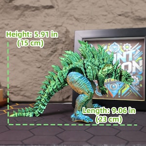 Side view of the fully articulated Godzilla kaiju figure in a dynamic stance, emphasizing the flexibility of its poseable limbs and segmented tail. The high-resolution photo showcases the chrome electroplated finish reflecting natural light, giving the figure a lifelike and powerful appearance. Ideal for use in toy photography or as a standout gift for boys, sci-fi collectors, or fans of classic movie monsters and gaming culture who appreciate well-designed collectibles.
