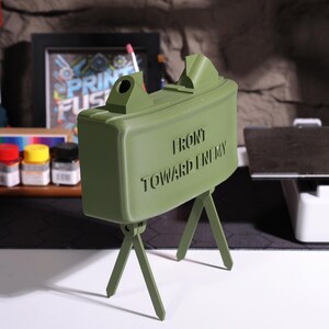 Realistic claymore Bluetooth speaker, military sound decor, personalized audio gift, claymore mine speaker, high-quality 3D printed speaker, unique home decor, military-inspired desk accessory, speaker for veterans, Bluetooth device with claymore