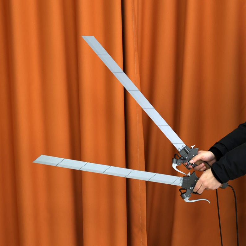 Attack on Titan collectible cosplay replica, 3D printed dual blades with removable blades, perfect for cosplay or display. This spring-loaded handle action provides an interactive cosplay prop for anime fans.