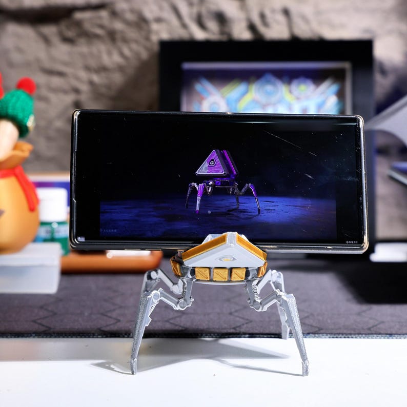 Apex Pack Loot Box Phone Stand with Rotatable Head - Handmade gaming accessory crafted from eco-friendly PLA material, ideal for Apex Legends fans, gaming desk decor, multi-functional phone holder for video calls and hands-free entertainment.