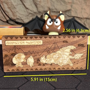 Classic Monster Hunter item icon wooden board, beautifully handcrafted from solid wood and basswood, with dual rear magnets for secure attachment to metal surfaces. This item icon board features symbols from the Monster Hunter game that are instantly recognizable to fans, including icons for health potions, traps, and other essential game items. This decorative board can be used as a practical fridge magnet or displayed as a unique piece of Monster Hunter artwork in your home.