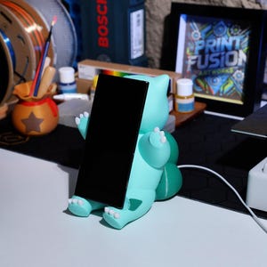 Eco-friendly charging station with a fun and unique plant creature design, ideal for fans of quirky, collectible phone accessories. Great holiday gift for collectors and gamers who appreciate practical and charming home decor.