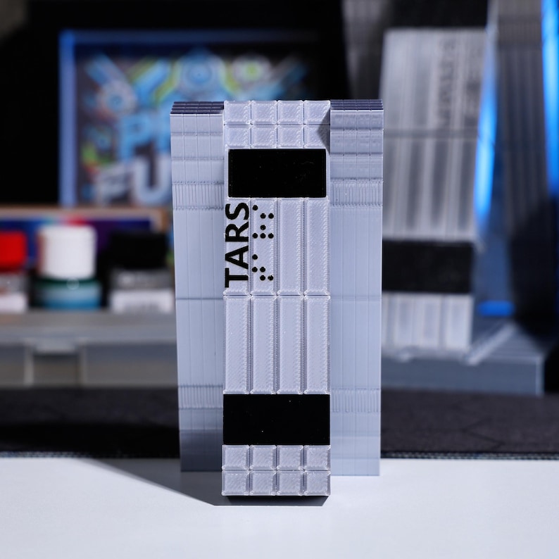 Personalized Christmas gift for sci-fi lovers, TARS Robot ornament with customizable screen and holiday greeting. Perfect gift for fans of space adventure movies, collectible decor with interactive features and dynamic visuals, great for desks.