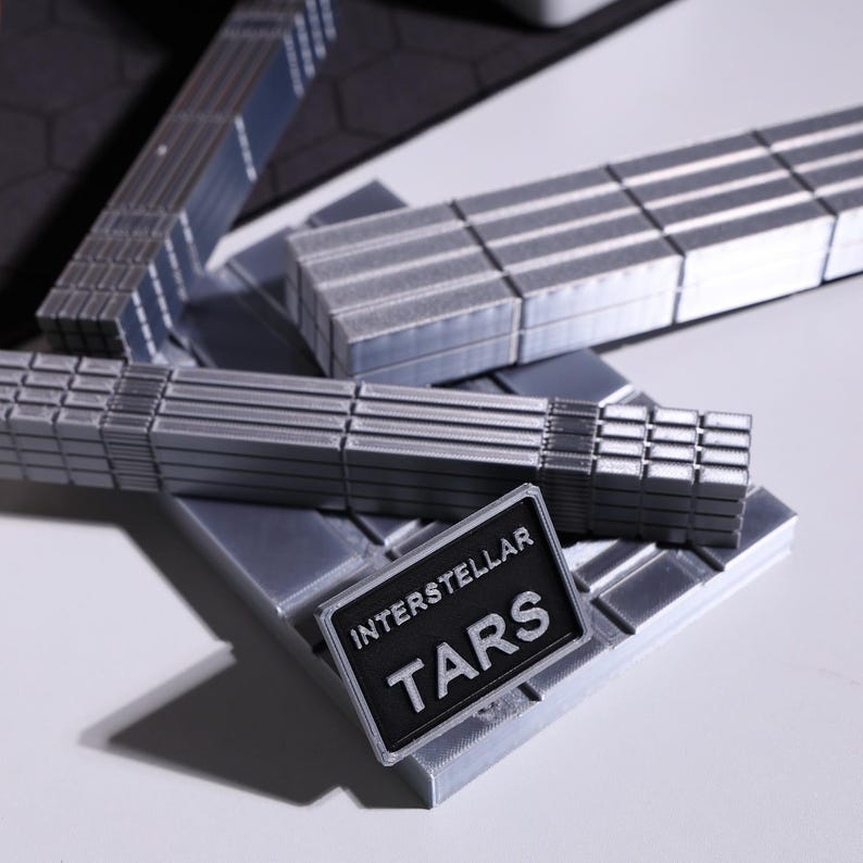 TARS-inspired robot model, Interstellar fan collectible, metallic-looking PLA figure with 360-degree articulation; minimalist sci-fi decor for home or office, magnetic modular blocks, timeless gunmetal and stainless steel color options for true fans.