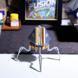 Custom-made gaming phone holder, unique Apex Legends loot box design, perfect for gamers, handcrafted from durable PLA material, a great option for gaming desk decor and hands-free phone viewing during gameplay or calls.