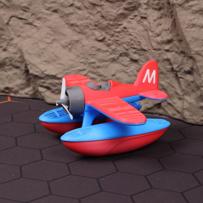 Floating seaplane in action during kids’ bath time, capturing its buoyant design and realistic airplane look. Crafted with vibrant, child-safe plastic and 3D printed to ensure long-lasting durability. Ideal as a holiday gift, stocking stuffer, or aviation-themed decoration. Excellent for educational purposes, introducing children to science and physics through water play. This versatile toy also functions as a cute desk ornament for aviation lovers