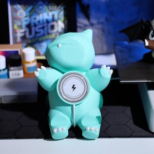MagSafe charging stand with cute plant character design, perfect for gaming lovers and collectors who enjoy unique, functional decor. Ideal Christmas gift for fans of whimsical phone accessories and nature-inspired gadgets.