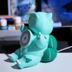 Unique phone stand charger featuring an adorable plant-themed design, MagSafe-compatible, and perfect for keeping your phone secure while charging. Ideal for gaming fans and collectors looking for fun, functional accessories.