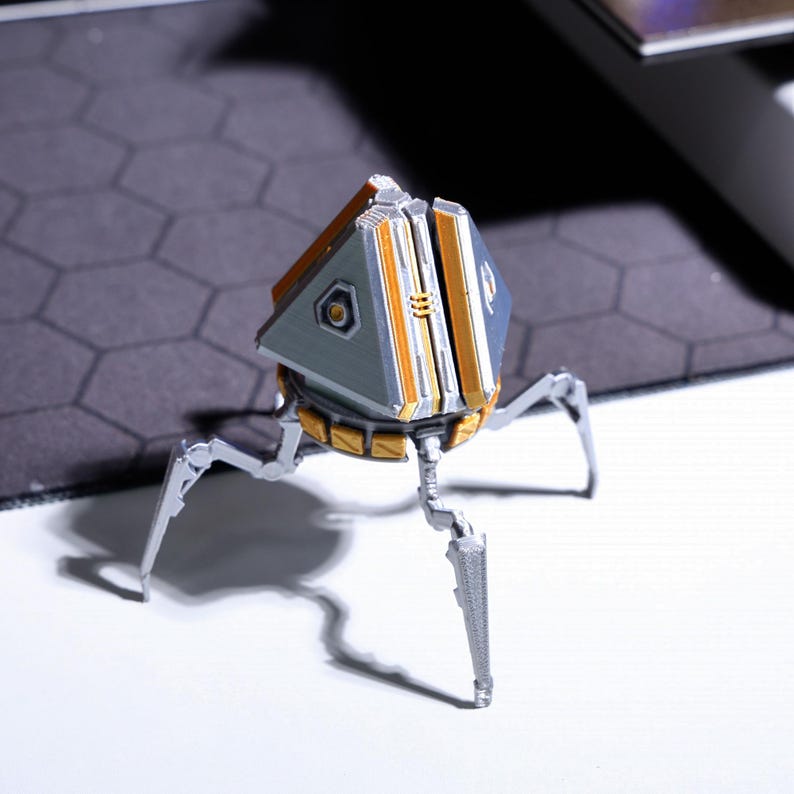 Rotatable loot box phone stand, ideal for gamers who need a multi-functional desk accessory, perfect for video calls and hands-free phone viewing, designed for Apex Legends fans, a perfect gift for gamers.