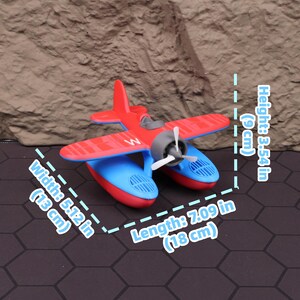 Realistic 3D printed floating seaplane toy gliding on a pool surface, ideal for fun water play for kids, while serving as an educational STEM toy that demonstrates buoyancy and basic physics. This floatplane model is a perfect gift for boys and girls who love airplanes, and doubles as a stylish aviation collectible. Use it as a Christmas stocking stuffer, Halloween party toy, or year-round learning tool. Designed with precision