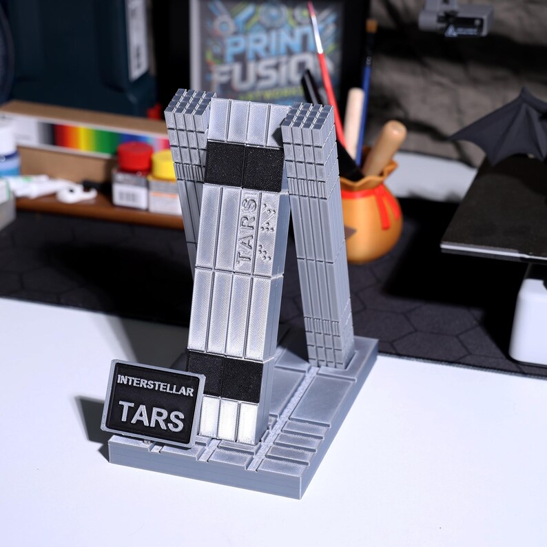 figure collectible, Interstellar TARS-inspired model with realistic metallic finish; magnetic joints for adjustable posing, modular design; ideal for fans of futuristic movie memorabilia, sci-fi decor, high-quality desk or shelf display figure.