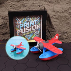 Floating seaplane model 3D printed for water play, shown floating in a bathtub, perfect as a kids’ educational toy teaching buoyancy and water dynamics. This unique floatplane design makes it an ideal Christmas gift, Halloween decoration, or holiday season present for aviation lovers and young pilots. Its colorful, detailed appearance also makes it a stunning aviation-themed shelf decoration. Great for STEM learning activities