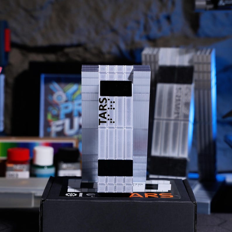 Personalized TARS Robot ornament for holiday season gift, customizable for Christmas, New Year or any occasion. Features interactive movie playback, collectible sci-fi decor for fans, unique home decoration for movie enthusiasts.