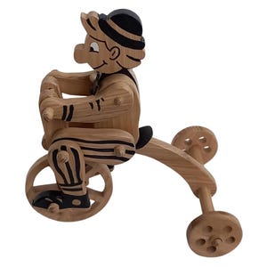 children&#39;s toy, moving clown  on wheels, handmade, made of wood, covered with ecological varnish, moves in two directions