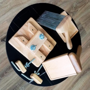 Two-row wool combs for fine to medium fibers, with a wooden holder featuring two clamps and wooden covers for protection