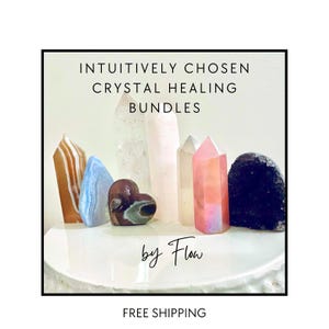 May include: A collection of intuitively chosen crystal healing bundles by Flow. The crystals are arranged on a white surface and include a heart-shaped crystal, a clear crystal, a pink crystal, a brown crystal, and a black crystal. Free shipping is offered.