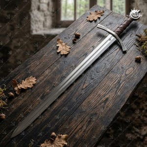 Faithkeeper Sword of the Knights Templar replica featuring a high carbon steel blade, leather grip, and engraved crossguard with scabbard.