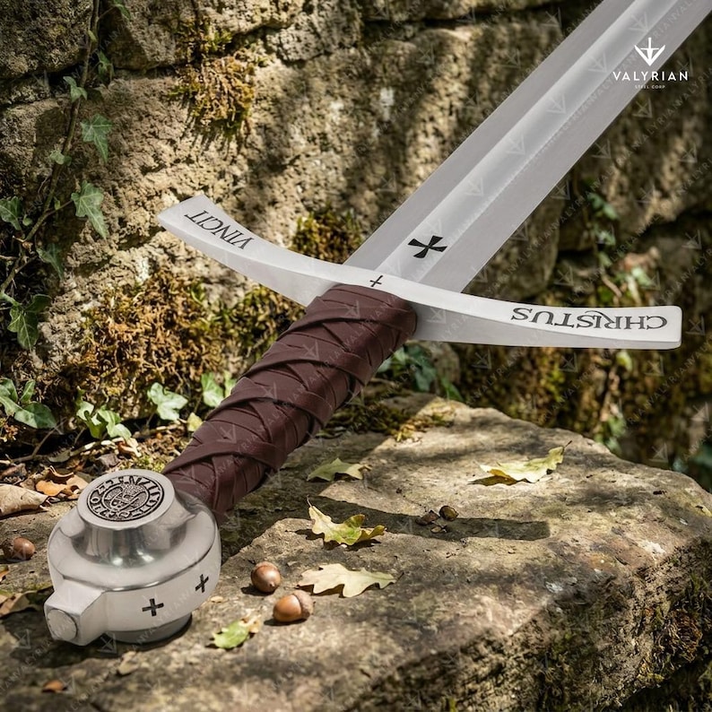 Faithkeeper Sword of the Knights Templar replica featuring a high carbon steel blade, leather grip, and engraved crossguard with scabbard.