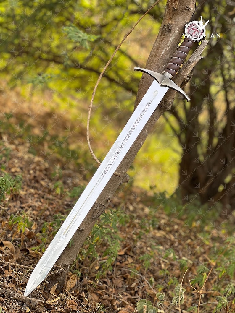 The Accolade Sword of the Knights Templar is a magnificent weapon of ceremony and devotion — a blade worthy of a Grand Master himself. Named “The Accolade,” this sword symbolizes the moment of knighthood, where a loyal member of the Order would be dubbed in service of faith. Its Latin inscription, “Non Nobis, Domine, Non Nobis, Sed Nomini Tuo Da Gloriam” defines the creed and humility of the Templars who shaped medieval history through faith and steel.