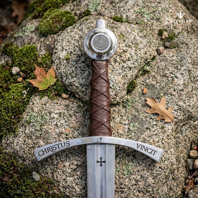 Faithkeeper Sword of the Knights Templar replica featuring a high carbon steel blade, leather grip, and engraved crossguard with scabbard.