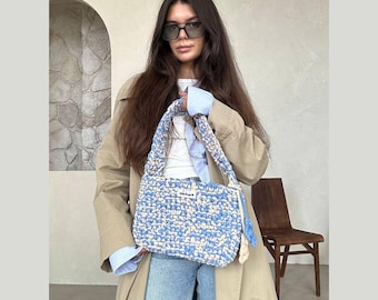 Medium flat shoulder bag with floral pendants, blue and beige, versatile for any season