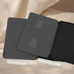 May include: A dark gray tablet case with a hand strap. The case is shown open and closed, with the text "NO HAND STRAP" and "WITH HAND STRAP" on the image. The case is made of a smooth material and has a contrasting gray hand strap.