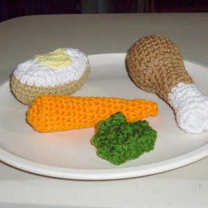 pattern-Chicken Leg, Baked Potato, and Peas/Carrot Dinner