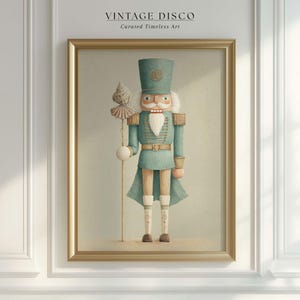 May include: Framed print of a teal nutcracker soldier with a white beard and a tall hat. The nutcracker holds a staff with a decorative top. The artwork is framed in a gold-colored frame and features the text "VINTAGE DISCO Curated Timeless Art".