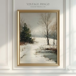 May include: A framed vintage landscape painting depicting a snowy winter scene. The artwork features a path winding through a snow-covered field, with trees and a body of water. The frame is gold, and the text "VINTAGE DISCO Curated Timeless Art" is at the top.