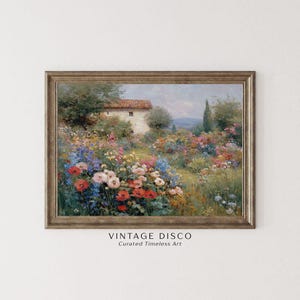 May include: A framed vintage painting depicting a vibrant garden scene with a stone house. The garden is filled with red, pink, blue, and yellow flowers. The frame is a warm, neutral tone. The text "VINTAGE DISCO Curated Timeless Art" is displayed at the bottom of the artwork.