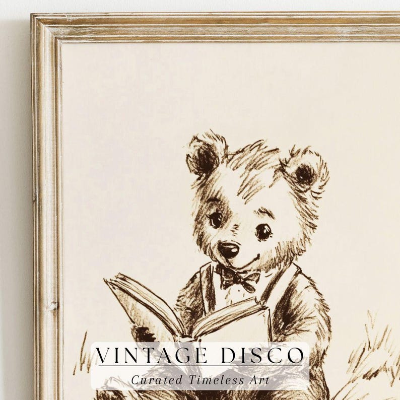 May include: A framed sepia-toned print featuring a charming bear reading a book. The bear is wearing a bow tie and suspenders. The print has the text "VINTAGE DISCO" and "Curated Timeless Art" at the bottom.