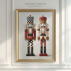 May include: Framed print featuring two decorative nutcrackers. One nutcracker is red and black checkered, the other is white and red striped. Both have mustaches, crowns, and are set against a neutral background. The frame is gold, and the text "VINTAGE DISCO" is at the top.