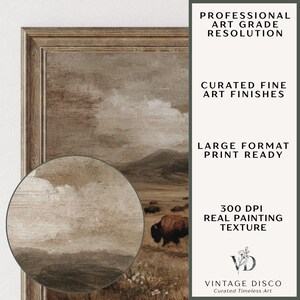 May include: A framed landscape painting featuring a herd of bison grazing in a field under a cloudy sky. The artwork has a vintage aesthetic with a detailed, textured finish. The frame is a warm brown color.
