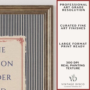 May include: A framed art print featuring a cream-colored paper with deckled edges, dark blue text, and a red decorative border. The print is set against a dark blue and white pinstriped background within a textured brown wooden frame.