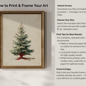Op de afbeelding: Een ingelijste print van een aquarel kerstboom met een rode strik. Het kunstwerk zit in een goudkleurige lijst. Tekst aan de rechterkant van de afbeelding luidt "How to Print & Frame Your Art".