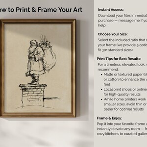 May include: A framed print featuring a black and white sketch of Santa Claus standing on a chimney, carrying a sack. The artwork is set against a beige background, with text on the right side. The frame is a warm gold color.