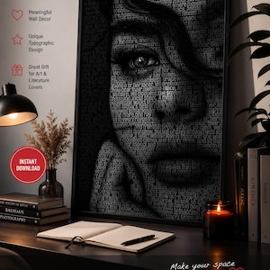May include: Typographic portrait poster featuring a woman's face composed of text. The black and white artwork is framed and displayed on a desk with books, a candle, and a lamp. The poster is a wall art print.