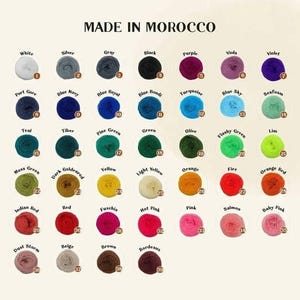 May include: A color chart of 39 yarn colors, with each color labeled with a name and number. The colors are arranged in rows and columns, and the chart is titled "MADE IN MOROCCO".