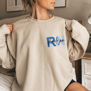 Custom Registered Nurse Sweatshirt With Name, Personalized RN Pocket Hoodie, RN Sweatshirt, Nurse Sweatshirt, Cute Nurse Gift, Nurse Gift