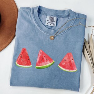 This image consists of Watermelon design for blue jean shirt.