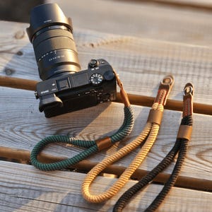 Camerapolsriem, verstelbare camerapolsriem, nylon riem, camerahandriem, cameraaccessoire, DSLR en spiegelreflexcamera.