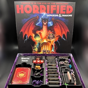 May include: A board game box set titled "Horrified Dungeons & Dragons." The box art features a red dragon and the game's title. Inside, the game includes monster tokens, cards, and other game components. The game's theme is horror.