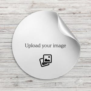 May include: A circular white sticker with a curled top right corner. The centre features the black text "Upload your image" positioned above a black icon representing two overlapping photographs with a small circle in the upper right corner.