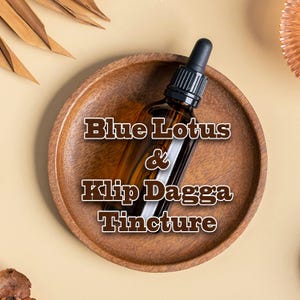 May include: A brown glass tincture bottle with a black dropper sits on a wooden plate. The bottle contains a liquid, and the text "Blue Lotus & Klip Dagga Tincture" is displayed on the image.