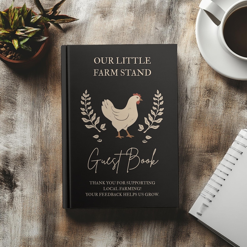May include: A black hardcover guest book featuring the text "OUR LITTLE FARM STAND" and "Guest Book" in white and tan lettering. A central illustration of a cream-colored chicken is flanked by two tan wheat stalks. The bottom text reads "THANK YOU FOR SUPPORTING LOCAL FARMING! YOUR FEEDBACK HELPS US GROW."