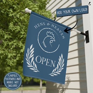 May include: A blue rectangular flag featuring a white line-art chicken inside a circle, the text HENS & HEAVEN, the word OPEN, and two laurel branches. A dark blue rectangular sign with the text ADD YOUR OWN LOGO points to the flag.