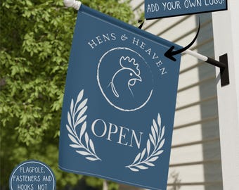May include: A blue rectangular flag featuring a white line-art chicken inside a circle, the text HENS & HEAVEN, the word OPEN, and two laurel branches. A dark blue rectangular sign with the text ADD YOUR OWN LOGO points to the flag.